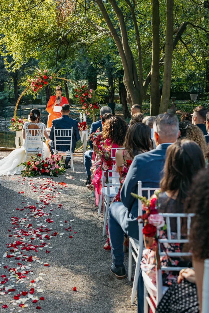 Wedding guests watching the ceremony in the garden