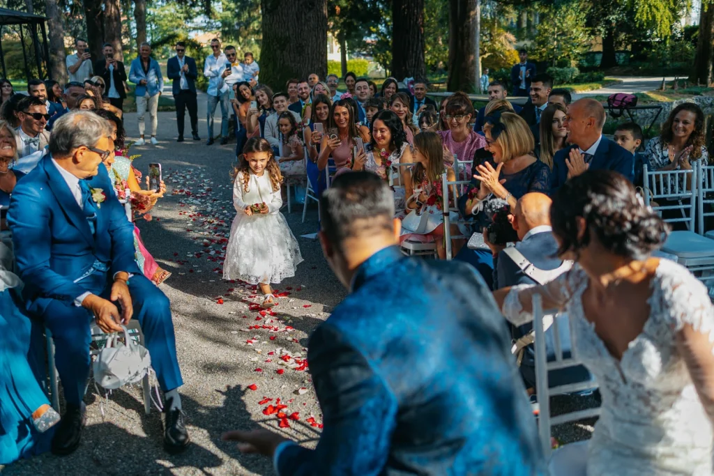 Bride walking down the aisle with her daughter and dog