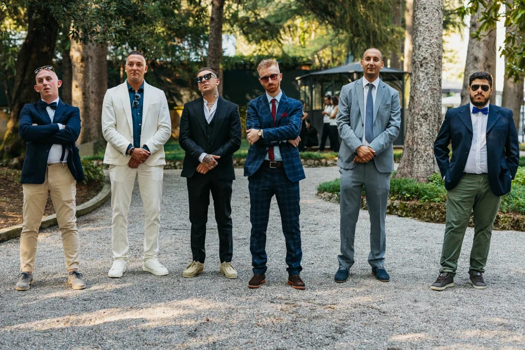 Group of wedding guests in formal attire outdoors