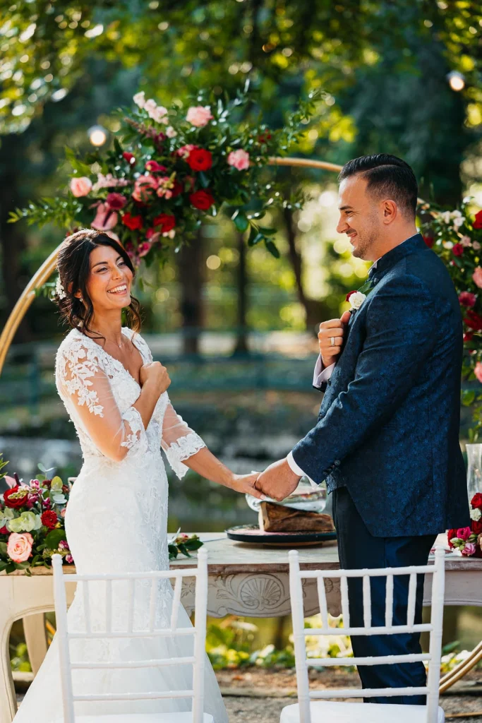 Bride smiling during her vows at the altar