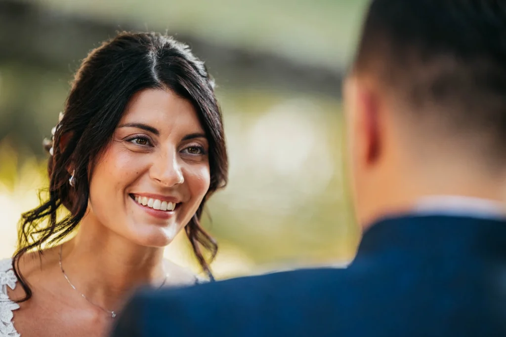  Bride looking at groom with a soft smile