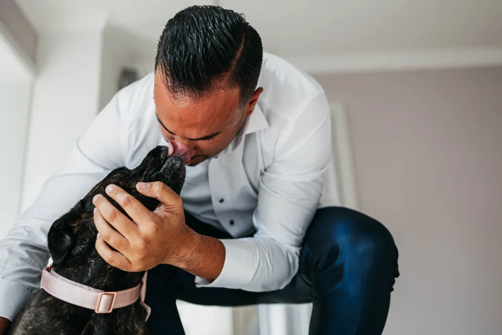 Groom tying his daughter’s shoes before the ceremony