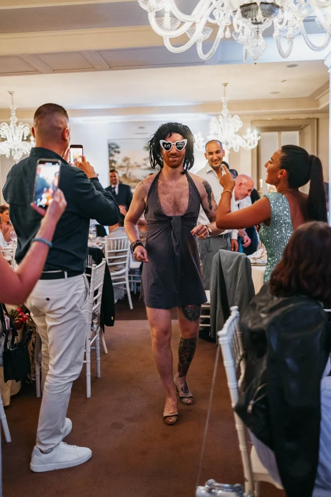 Bride wearing sunglasses and dancing her way into the reception