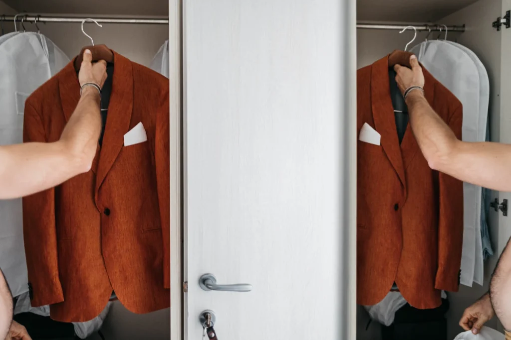 Ravello Wedding at Belmond Hotel Caruso – Amalfi Coast Destination Wedding 13 Orange wedding suits hanging inside a closet