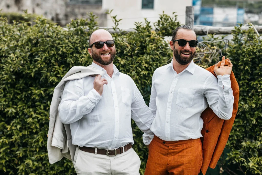 Ravello Wedding at Belmond Hotel Caruso – Amalfi Coast Destination Wedding 16 Two groomsmen smiling in sunglasses outside