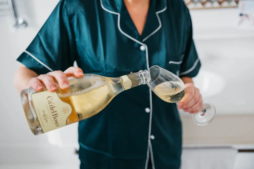 Ravello Wedding at Belmond Hotel Caruso – Amalfi Coast Destination Wedding 25 Close-up of champagne bottle being opened in bridal suite