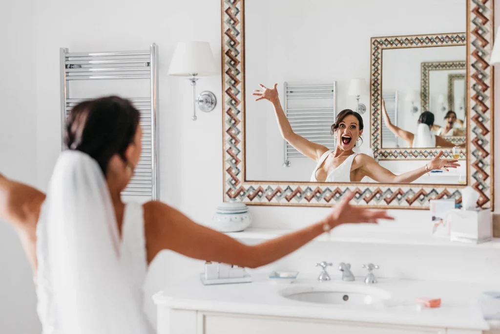 Ravello Wedding at Belmond Hotel Caruso – Amalfi Coast Destination Wedding 28 Bride looking into the mirror while getting ready