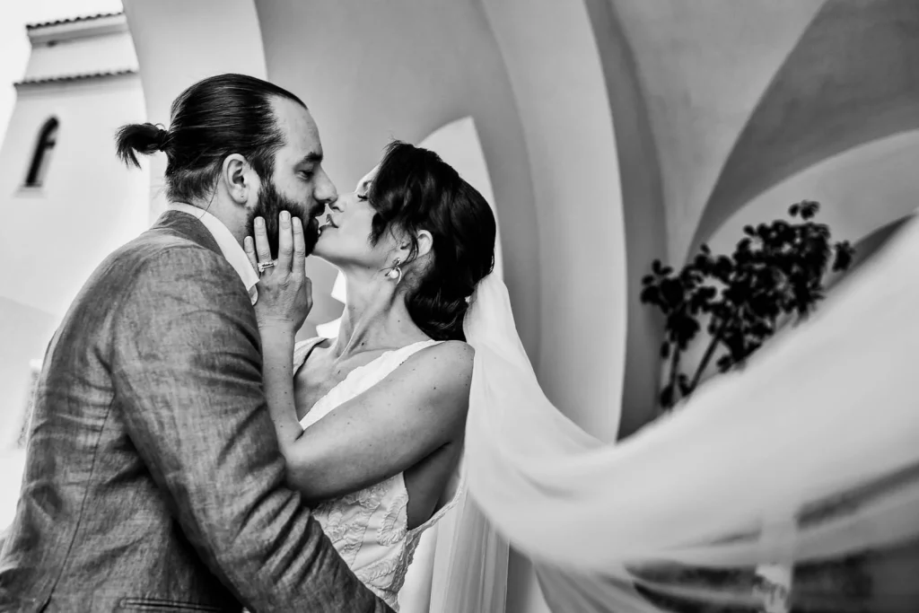Ravello Wedding at Belmond Hotel Caruso – Amalfi Coast Destination Wedding 53 Groom lifting bride’s veil for a kiss