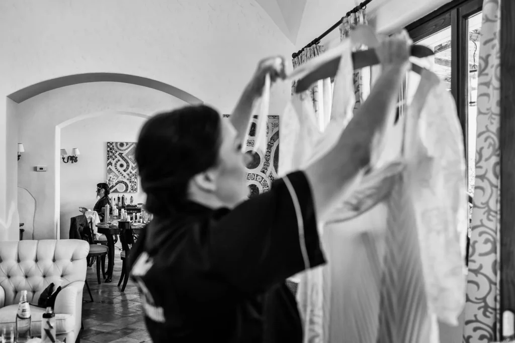 Ravello Wedding at Belmond Hotel Caruso – Amalfi Coast Destination Wedding 7 Bridesmaid arranging the bride’s dress