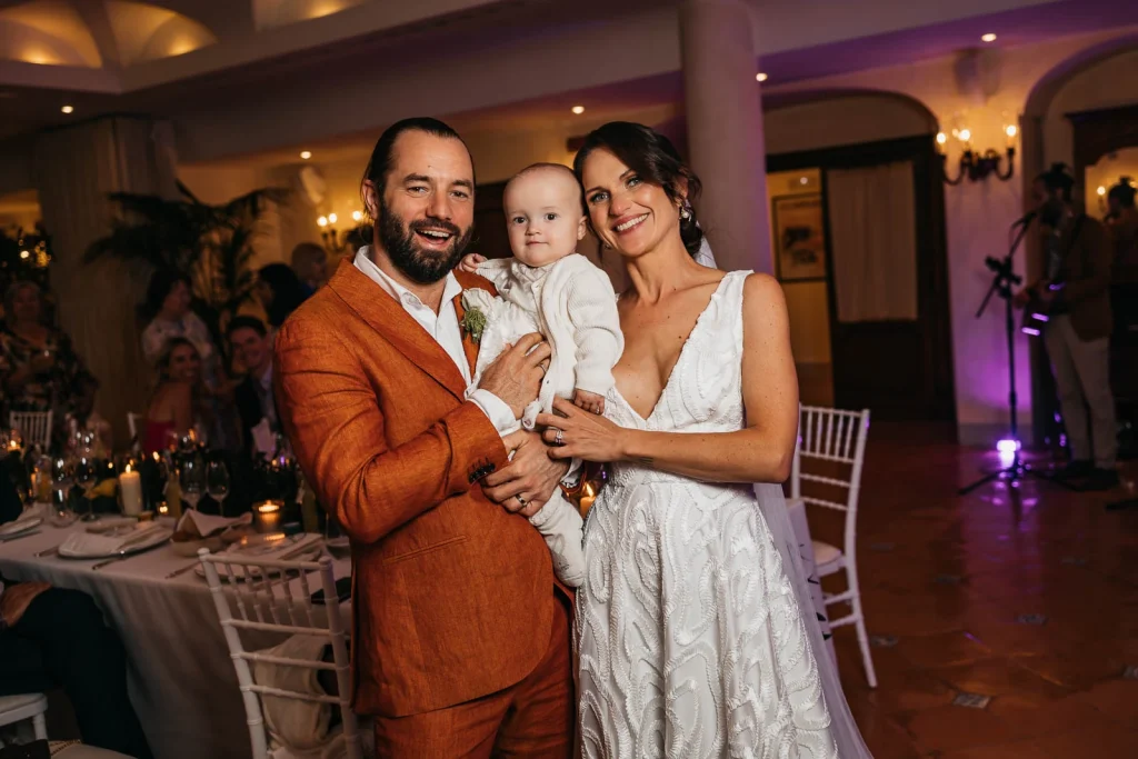Ravello Wedding at Belmond Hotel Caruso – Amalfi Coast Destination Wedding 71 Bride and groom holding their baby girl Florence