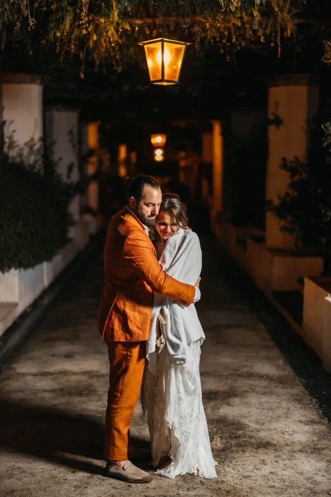 Ravello Wedding at Belmond Hotel Caruso – Amalfi Coast Destination Wedding 79 Bride and groom holding each other during a romantic night walk