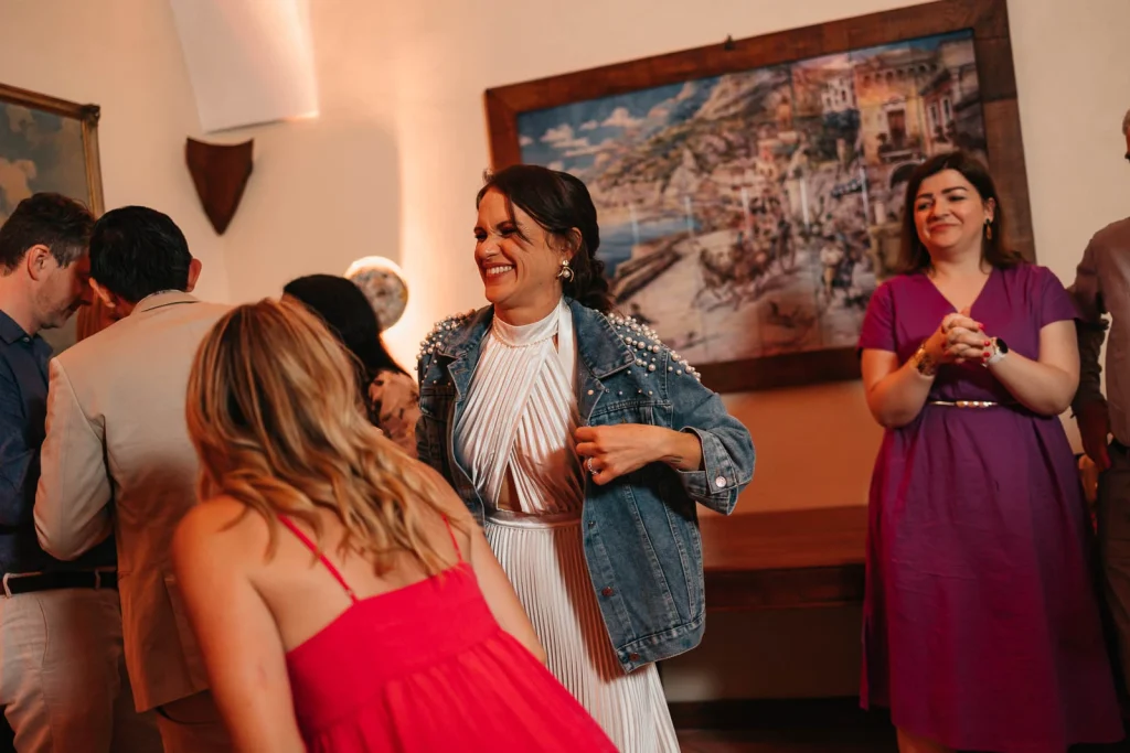 Ravello Wedding at Belmond Hotel Caruso – Amalfi Coast Destination Wedding 87 Guest in striped shirt singing and clapping