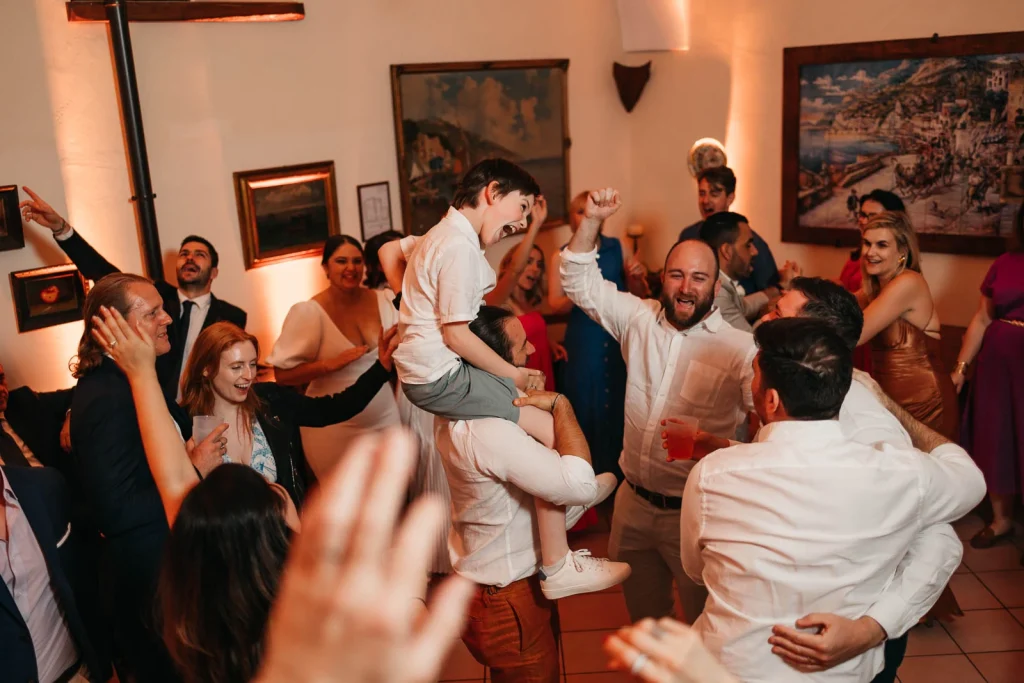 Ravello Wedding at Belmond Hotel Caruso – Amalfi Coast Destination Wedding 89 Groom being lifted by friends on the dance floor