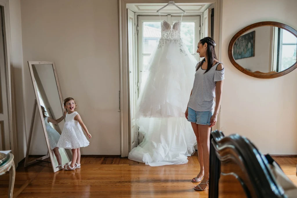 Dream Wedding at Villa Le Due Torrette in Erba: The Elegance of a Lake Como Celebration 17 Bride and daughter admiring the wedding dress at Villa Le Due Torrette