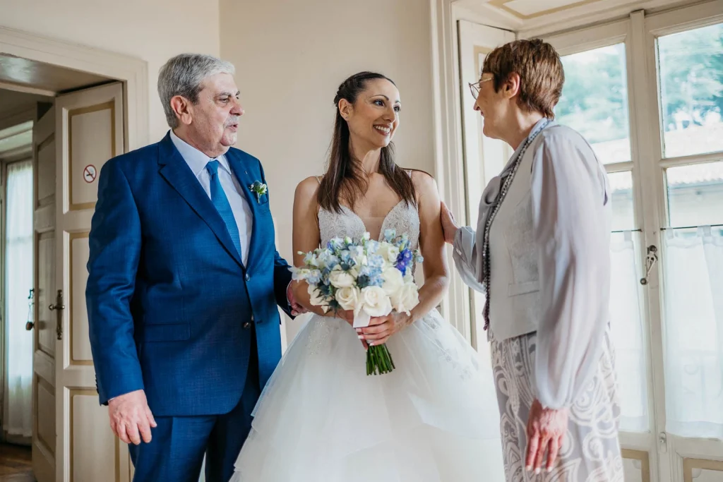 Dream Wedding at Villa Le Due Torrette in Erba: The Elegance of a Lake Como Celebration 23 Bride and her father ready to walk down the aisle at Villa Le Due Torrette