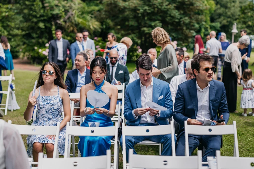 Dream Wedding at Villa Le Due Torrette in Erba: The Elegance of a Lake Como Celebration 29 Wedding guests dressed in shades of blue at a Lake Como ceremony