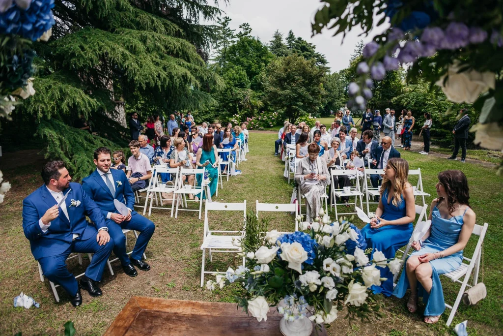 Dream Wedding at Villa Le Due Torrette in Erba: The Elegance of a Lake Como Celebration 31 Flower arrangements at the altar with blue accents