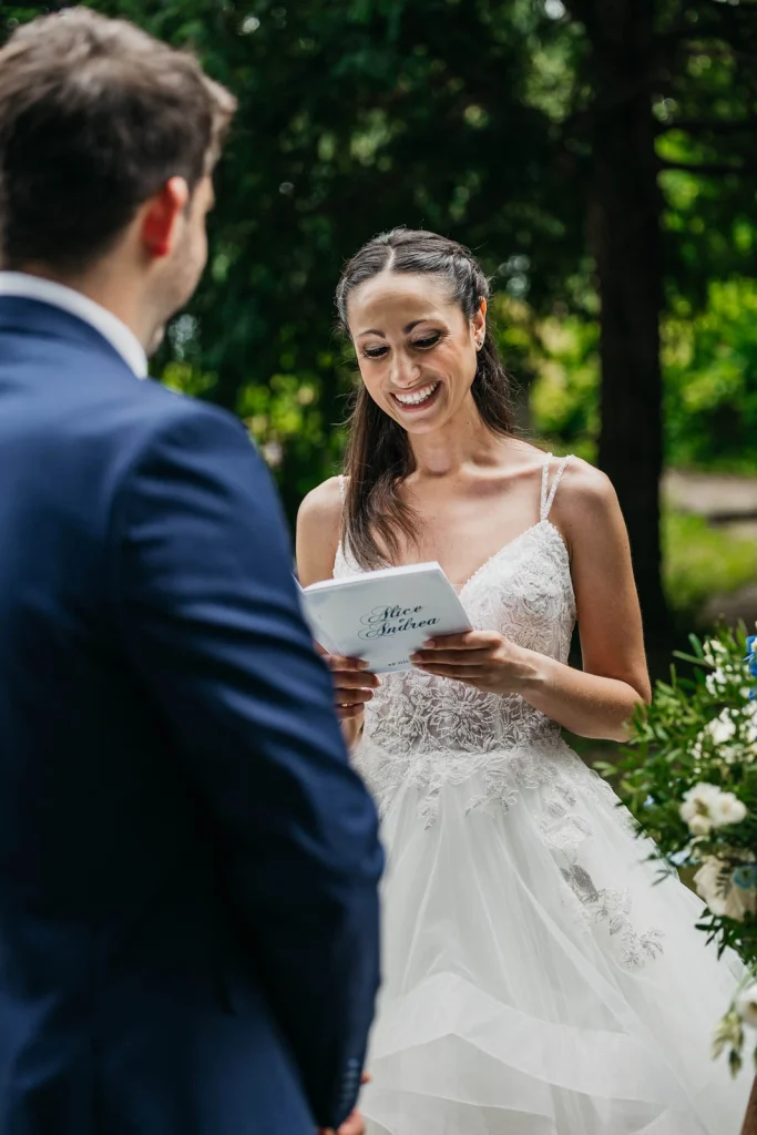 Dream Wedding at Villa Le Due Torrette in Erba: The Elegance of a Lake Como Celebration 40 Bride reading her vows to the groom at Villa Le Due Torrette