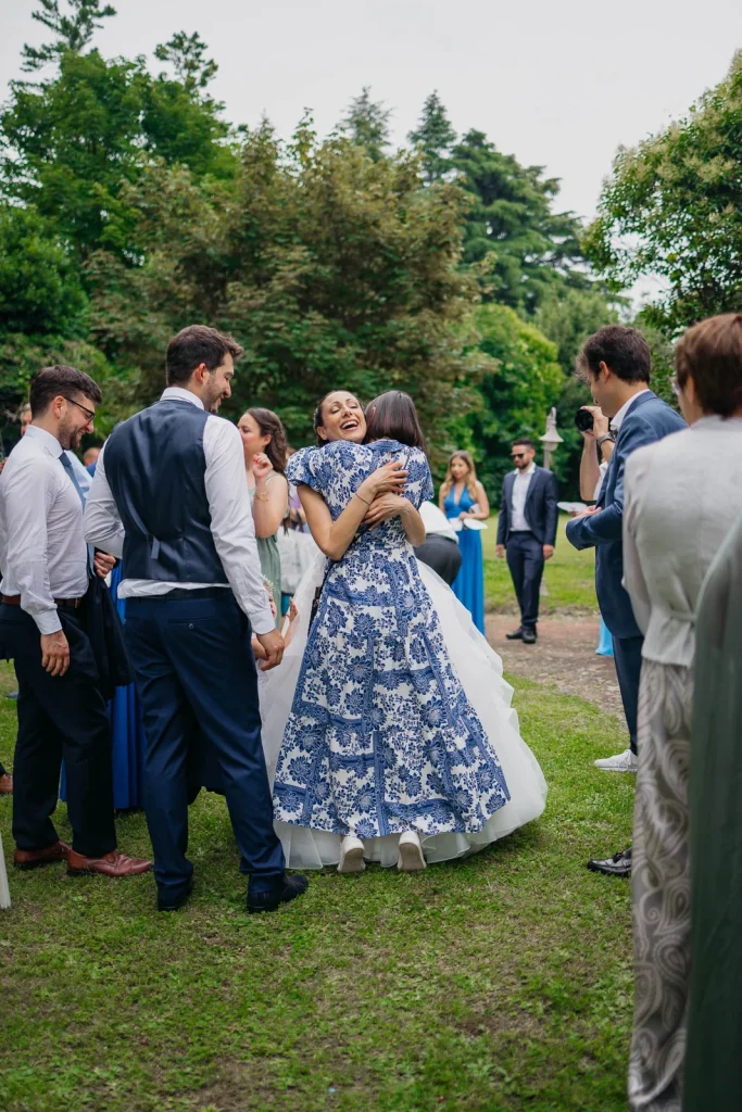 Dream Wedding at Villa Le Due Torrette in Erba: The Elegance of a Lake Como Celebration 49 Bride dancing with guests during Lake Como wedding reception