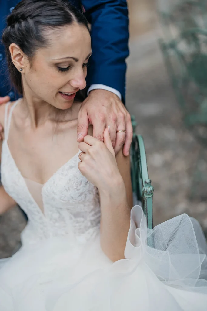 Dream Wedding at Villa Le Due Torrette in Erba: The Elegance of a Lake Como Celebration 61 Bride touching groom’s shoulder, smiling softly during couple session