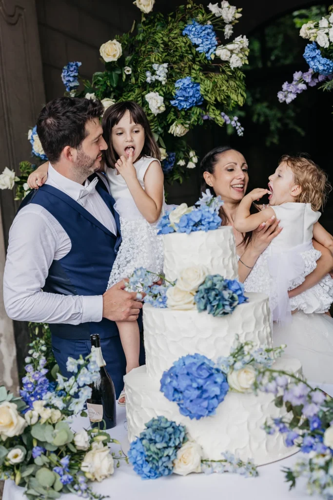 Dream Wedding at Villa Le Due Torrette in Erba: The Elegance of a Lake Como Celebration 83 Groom laughing with bride as she catches bouquet