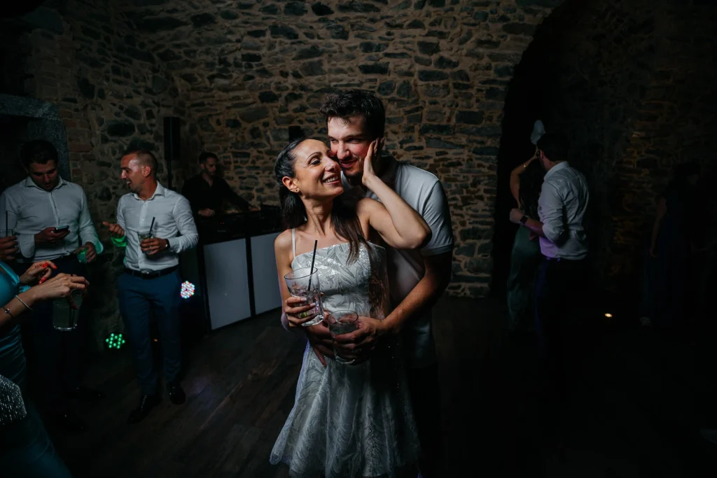 Dream Wedding at Villa Le Due Torrette in Erba: The Elegance of a Lake Como Celebration 93 Bride and groom embrace during indoor dance at Villa Le Due Torrette wedding