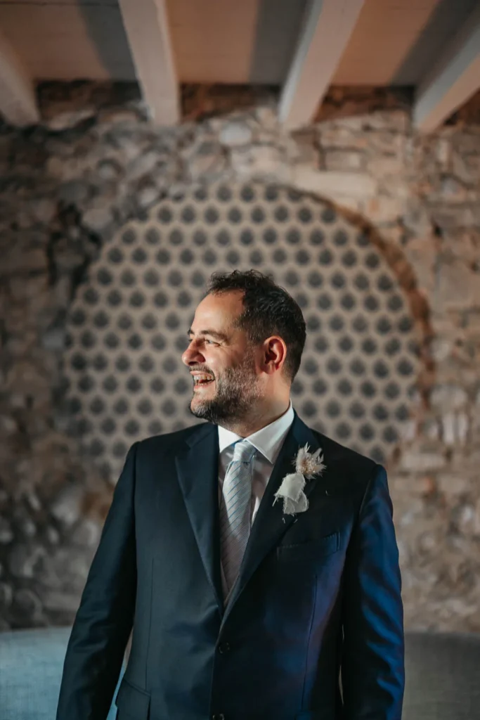 Bride smiling in black and white portrait before walking down the aisle