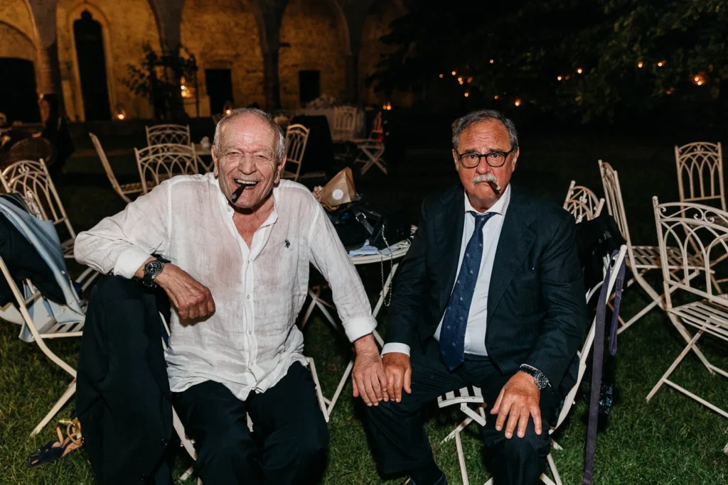 Older guests laughing and relaxing during the late night party
